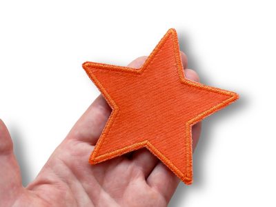 Nahaufnahme Stern-Cord-Bügelpatch orange, Baumwollcord 10 x 10 cm, orangefarbener Stern-Aufnäher sternförmig handmade Berlin Piratenbande